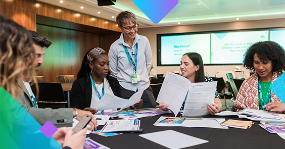 Women reading over paperwork at a conference table