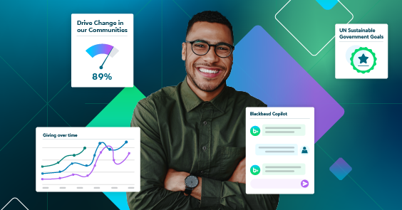 man smiling in a green shirt his arms folded with graphs